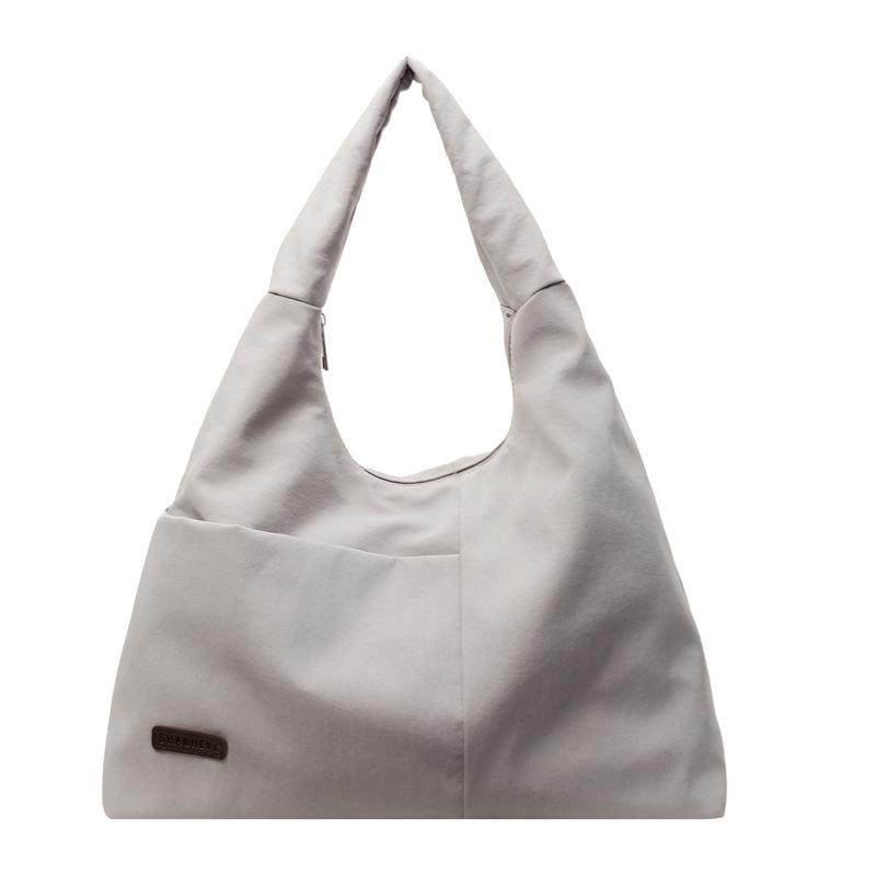 Einfache und große Unterarmtasche Damen einfarbig vielseitige Nischen-Schultertasche Nylon-Textur Pendler-Handtasche