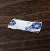 Takumi-style Arita ware sashimi plate, with blue and white porcelain four-flower design paper placemat, rectangular plate, made in Japan.