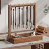 Solid Wood Calligraphy Brush Holder: Desktop Pen Rack with Scholar's Treasures Ornament and Metal Hook Design.