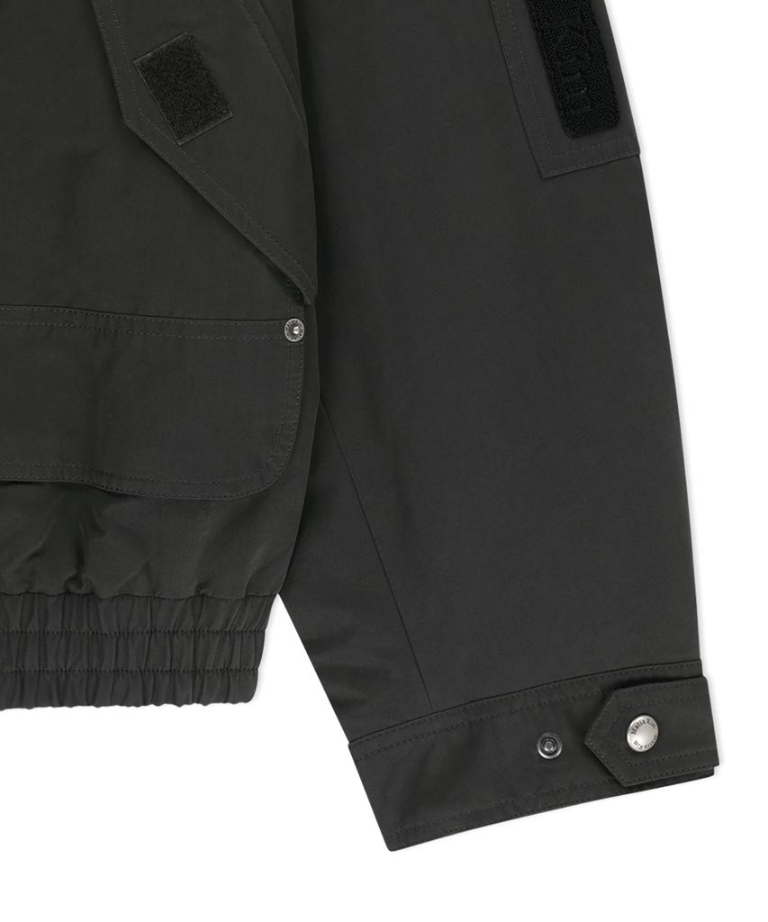 MATIN KIM Buckle High Neck Utility Jumper In Charcoal