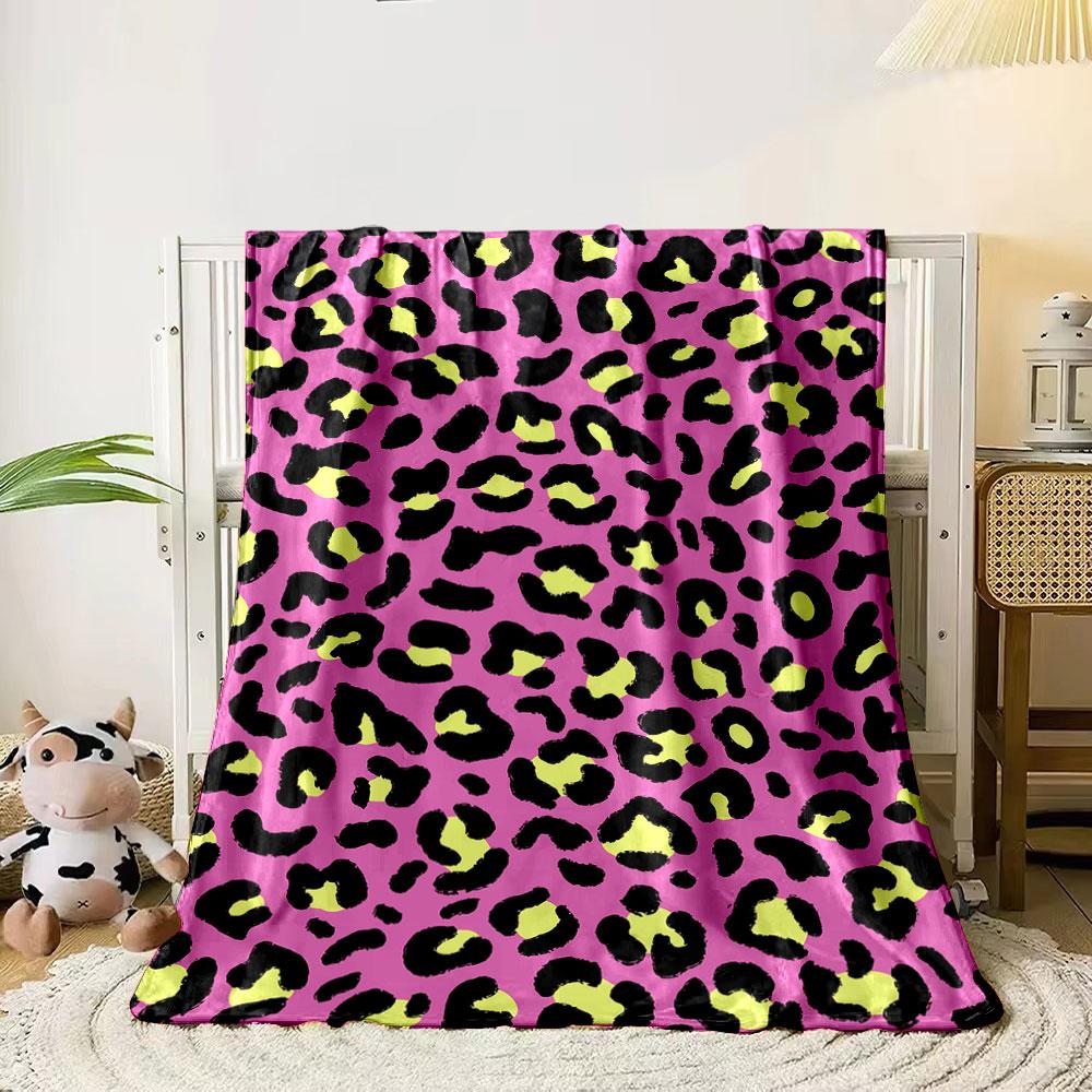 Leopard print pattern with black and yellow spots on a pink background. for all seasons blanket lunch break throw gift 80cm x 120cm