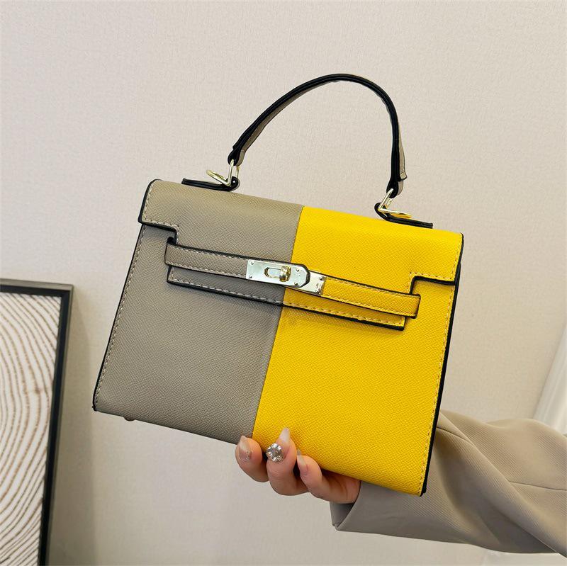 Color Block Kelly Bag: Trendy Two-Tone, Large Capacity, Versatile Shoulder & Crossbody Bag for Work Commute.