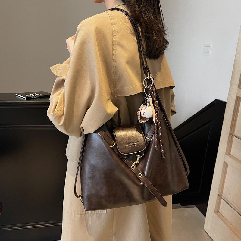 

Премиальный ретро-рюкзак для женщин большой вместимости, многоцелевая сумка через плечо, сумка-тоут no pendant темно-коричневого