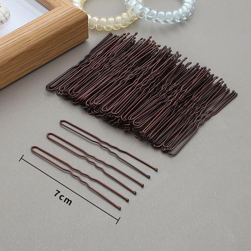 

Черная шпилька-зажим из стали для укладки прямых челок и густых волос