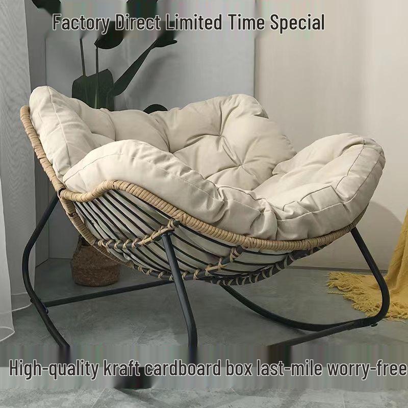 Rattan Rocking Chair: Comfortable Indoor/Outdoor Lounge with a Wrought Iron Frame.