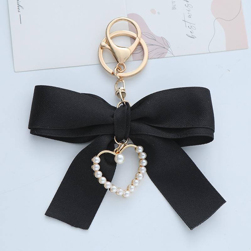 Elegant Pearl Strand Bow Keychain with Heart Charm, Octagonal Shape, Floating Fun-Themed Accessory, with Split Ring Closure for Handbags and Car Keys