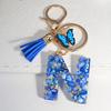 1pc Custom Blue Alphabet Letter Keychain with Butterfly Pendant Resin Ladies Key Ring with Tassel - Elegant Accessory for Bags Backpacks