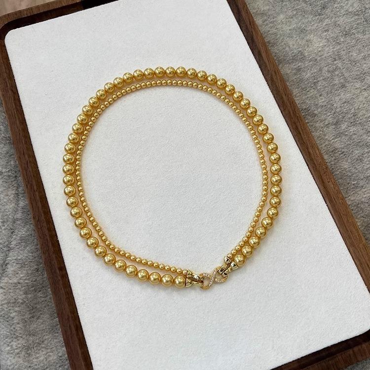 

Micro-Inlaid 8-Character Buckle Can Be Split Into Tea Gold Shijia Pearl Double-Layer Necklace Light Luxury Temperament Strong Light Round Sweater