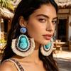 Bohemian Ethnic Tassel Earrings: Handmade Pom-Pom Jewelry with Retro Ear Hooks, Personalized Vacation Style for Women.