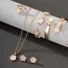 Elegant 5-Piece Flower Jewelry Set: Necklace, Bracelet, Earrings, and Ring.