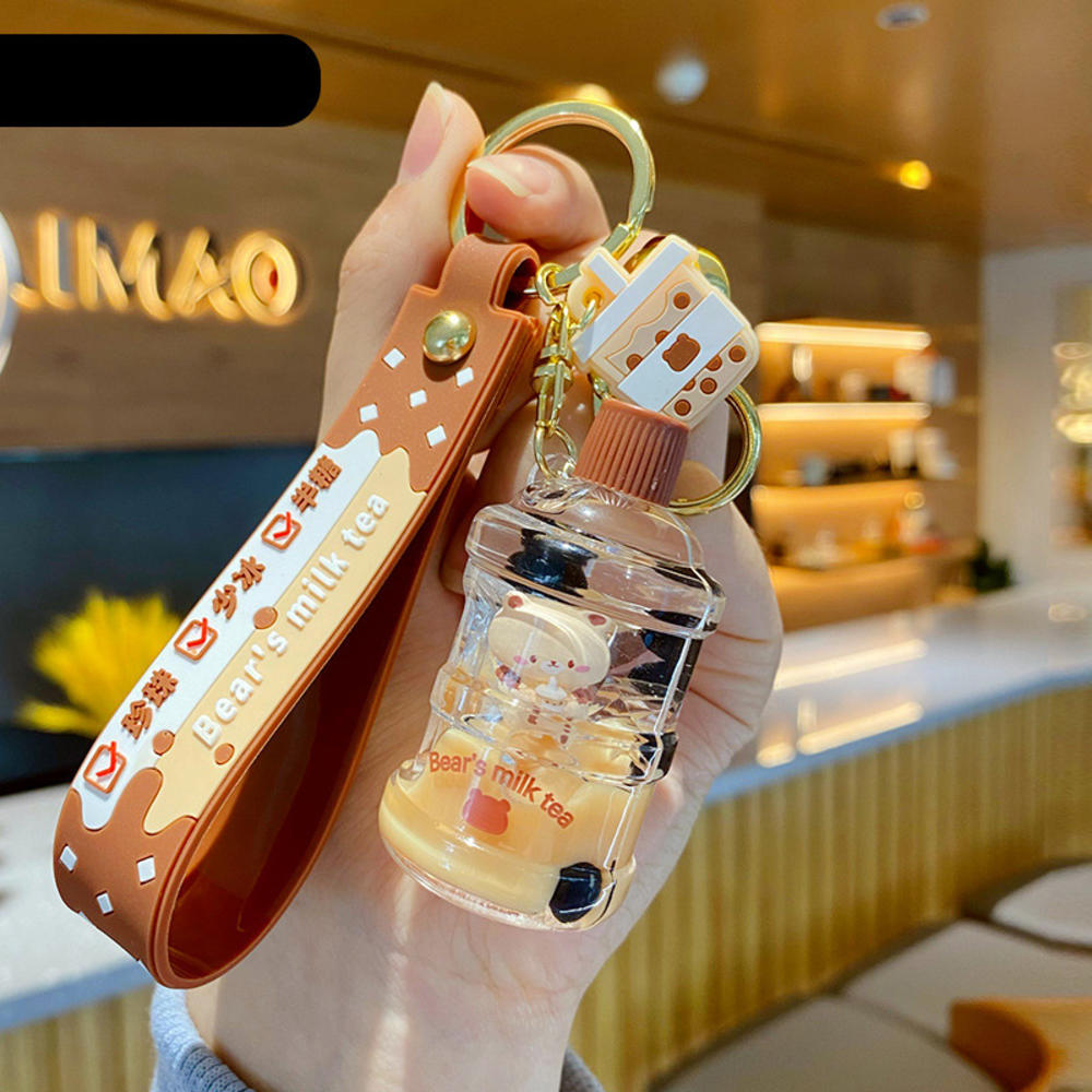Cartoon oil floating liquid quicksand bottle pearl milk tea bear key chain cute trendy car key chain pendant Key Ring