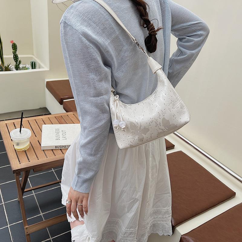 Handheld shoulder bag women's spring and summer new dumpling bag high-end commuter messenger bag