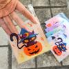 100pcs Halloween Gift Bags. Self-adhesive with pumpkin, ghost & bat designs for party treats.
