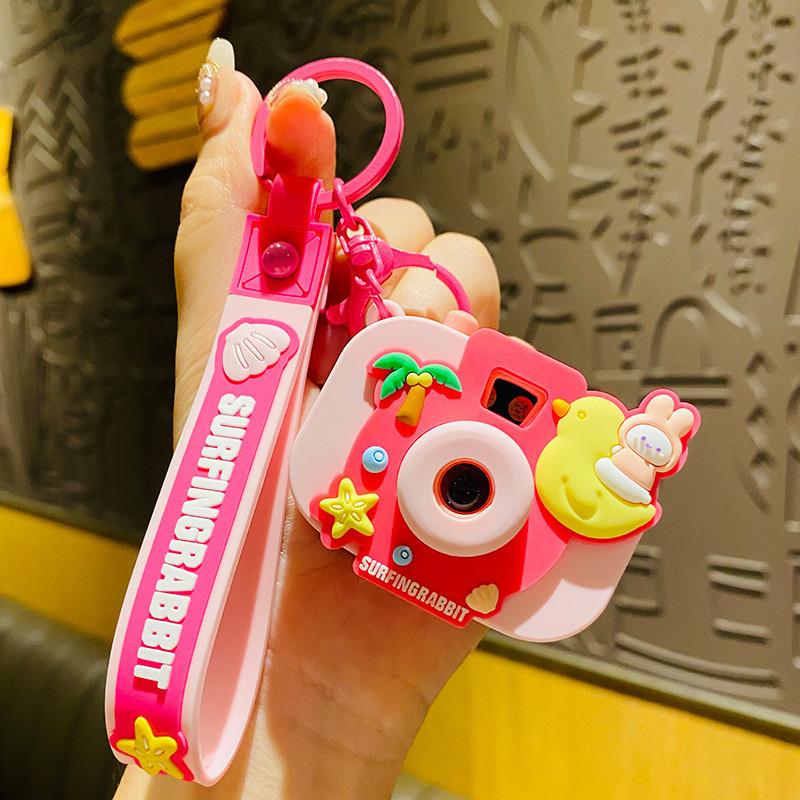

Whimsical Surfing Rabbit Camera Keychain Cute And Fun Accessory For Bags рожевий