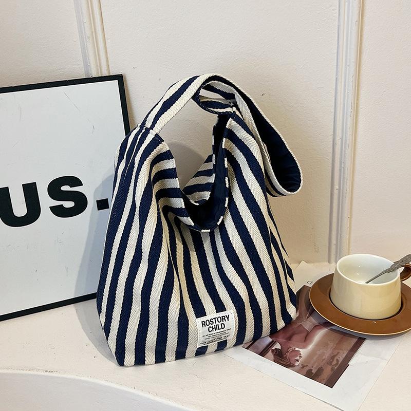 

Korean version of retro literary handbag simple small fresh striped shoulder bag casual fashion large capacity shopping bag bag синій
