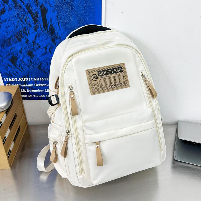Schoolbag is specially designed for new schoolbags, female students, nylon retro simple, junior high school students, male large-capacity couple .