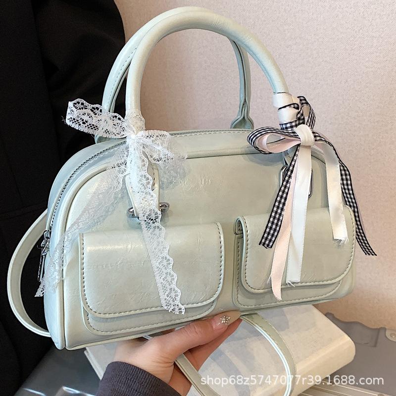 Versatile Korean version ins fashionable new portable Boston bag foreign style solid color oily skin niche simple messenger women's bag