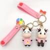 Kreskówka krowa lalka brelok do torby szkolnej wisiorek brelok samochodowy para brelok na klucze prezent