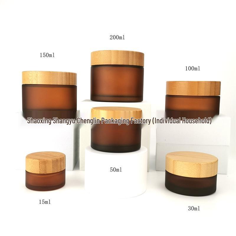 

Bamboo Wood Packaging for Cosmetic Face Cream: Amber Frosted Glass Bottles in 50g, 100g, 150g, and 200g sizes.