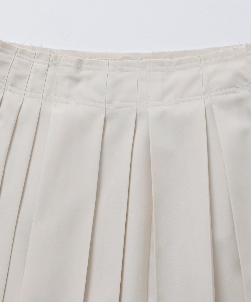 Moseullu Unbalanced Pleats Skirt (Ivory)