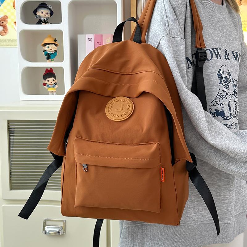 Stylish simple large-capacity couple student schoolbag new junior high school high school student backpack fashion
