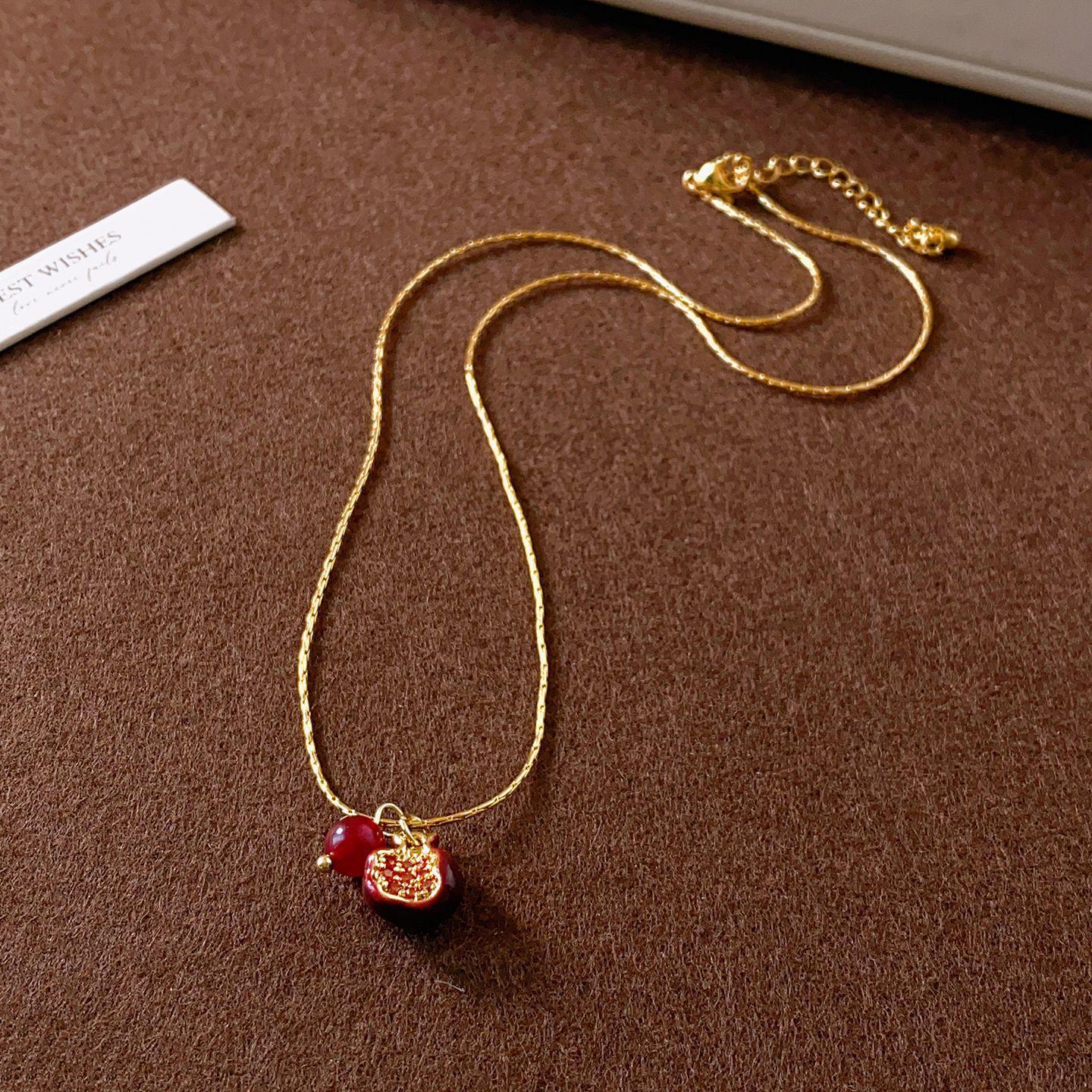 

Titanium Steel Agate Beaded Oil Dripping Pomegranate Pendant Necklace Women S Retro Light Luxury Sweater Chain Niche Design Accessories