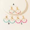 Explosive color hollow rice bead earrings Bohemian style women's jewelry earrings design sense spot