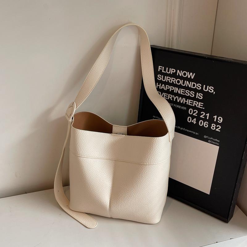 

Fashion underarm bag women s bag 2025 new simple bucket bag wide shoulder strap single shoulder messenger bag mother and child bag