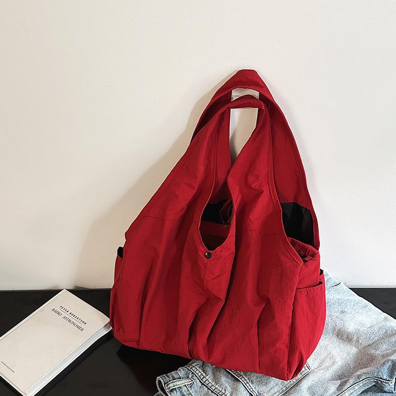 Neue Damen-Tragetasche mit mehreren Taschen, schlichtes und Nischen-Design, großes Fassungsvermögen, hochwertiges Gefühl, modisch, zum Tragen in der Hand, Schulter