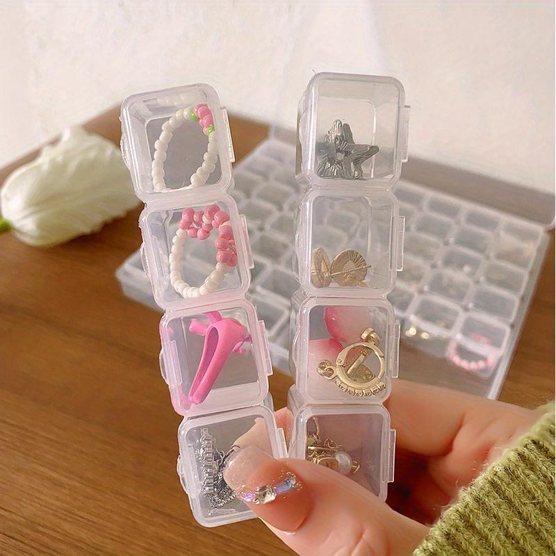 A Transparent Plastic Jewelry Box with 28/56 Compartments for Storing Earrings, Beads, and Crafts.