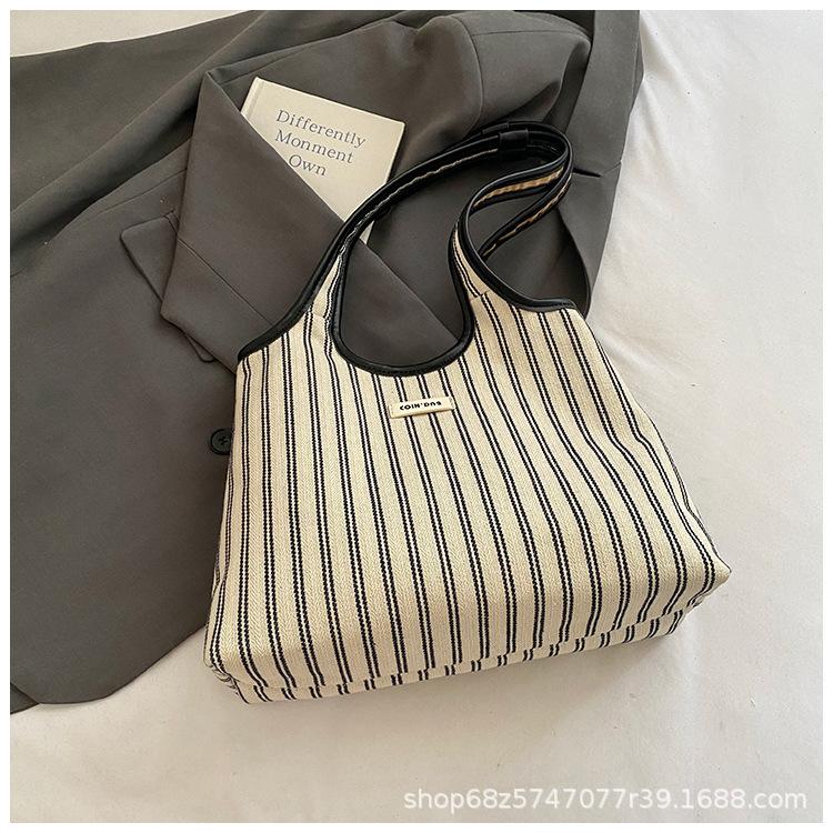 2025 lässige Pendler-Tragetasche Damen Nische gestreift schlicht Mode tragbare Umhängetasche große Kapazität Unterarmtasche