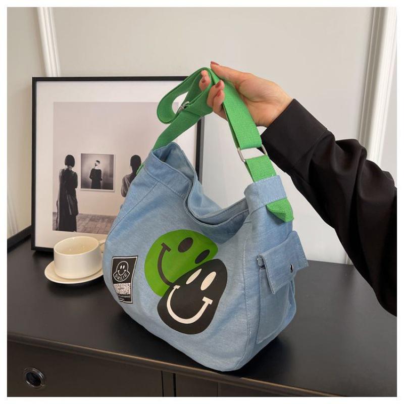 2024 New Korean Style Women's Denim Crossbody Bag: Artistic Smiley Face Canvas with Wide Shoulder Strap