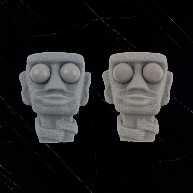 Jucărie Antistres Figurină Piatră cu Revenire Lentă - Strânge Ochi Mobili Expresie Amuzantă Stil Moai Cadou Relaxant Pentru Copii