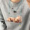 Stilvolle Welpen-Anhänger-Halskette: Abnehmbares Lederseil, Vielseitige lange Kette, Schlichtes Nischendesign für Frauen.