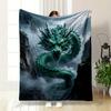 A Green, Serpentine Dragon with Glowing Eyes Emerges Amidst Misty Cliffs. for All Seasons Blanket Lunch Break Throw Gift