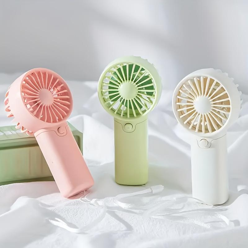 Compact Handheld Fan - Portable, Battery-Powered Personal Cooling Device for Travel & Outdoor Use, AAA Batteries Not Included