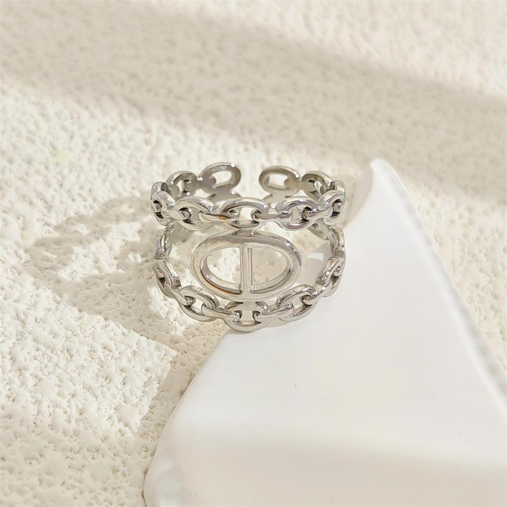 Stainless Steel Hollow Ring - European & American Cold Style Niche Design Light Luxury Women's Fashion