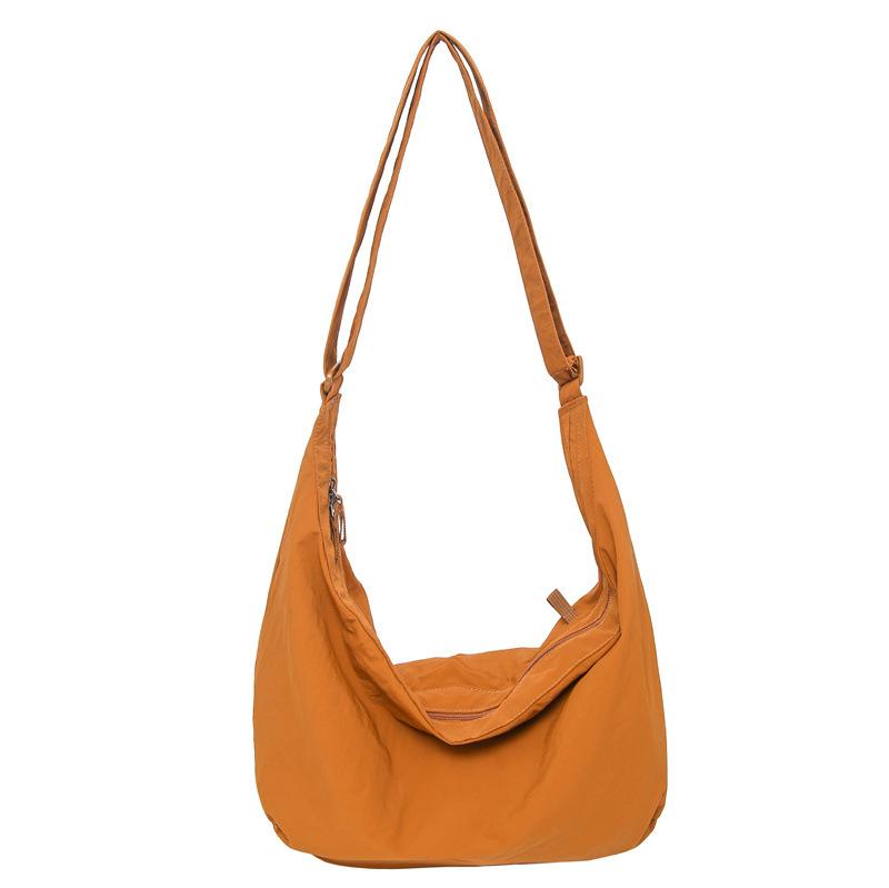 

New product wholesale simple solid color nylon cloth dumpling bag large capacity light leisure versatile commuter travel messenger bag