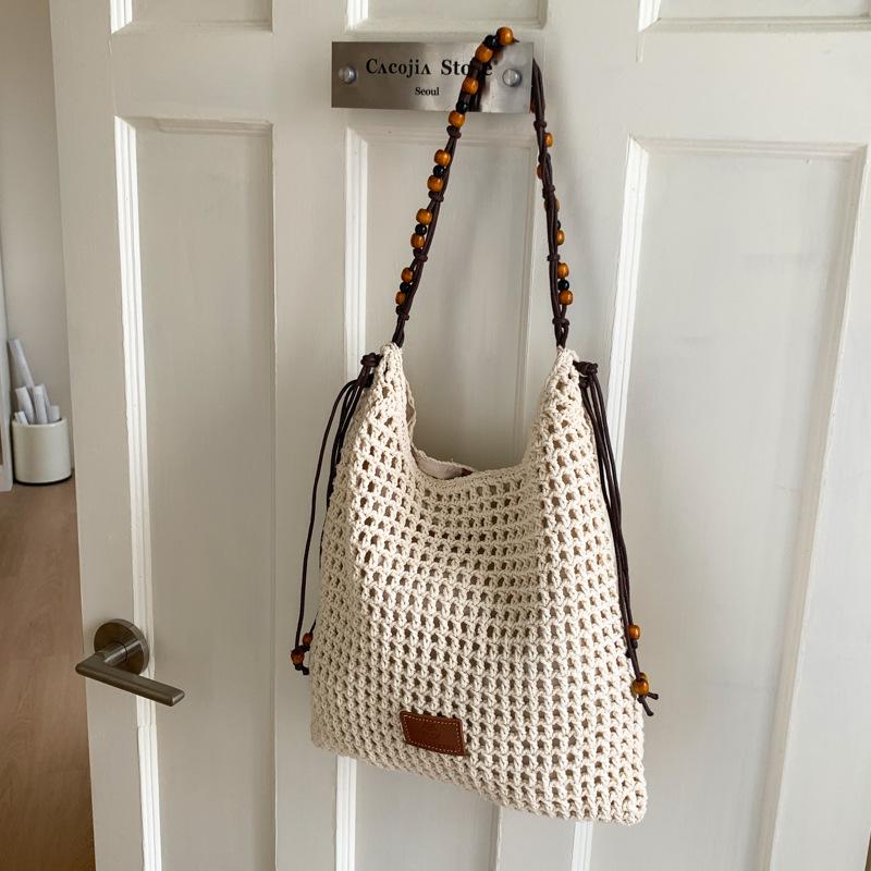 

Holiday beach bag women s new hollow woven handbag large-capacity commuter versatile messenger bag