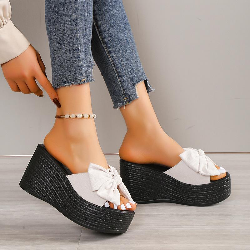 Sandals women spring and summer new slope heel thick bottom go out bow slippers fashion one word drag women