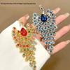 Inlaid Colored Diamond Peacock Brooch: Luxurious Retro Palace Style with Pearlescent Elegance