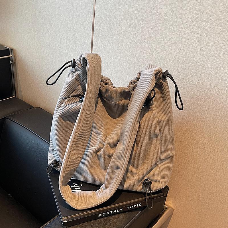 Autumn and Winter New Corduroy Tote Bag Women's Niche Drawstring Design Shoulder Bag Large Capacity Messenger Bag Commuting Versatile