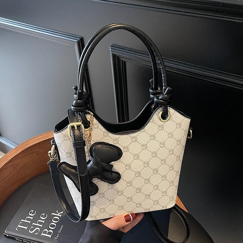 Korean version of trend, high-end printing temperament, portable bucket bag, niche fashion commuting versatile light luxury messenger bag, women
