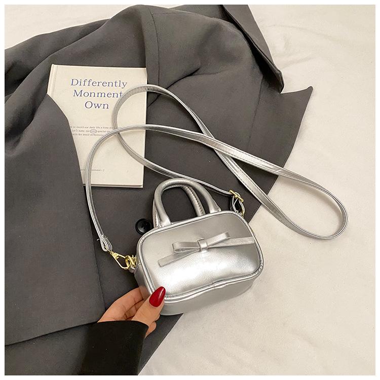 

2025 Spring and Summer Small Square Bag Simple Versatile Fashion Mobile Phone Bag Handheld Crossbody One Shoulder Bow Bowling Bag Women