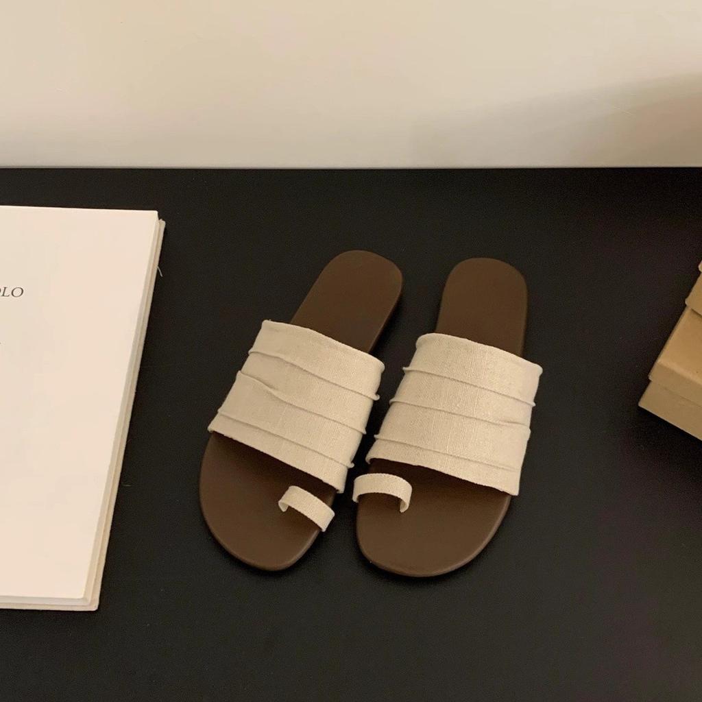 Holiday wind cover toe flat slippers women's outer wear summer 2025 new casual one-word drag temperament beach women's shoes