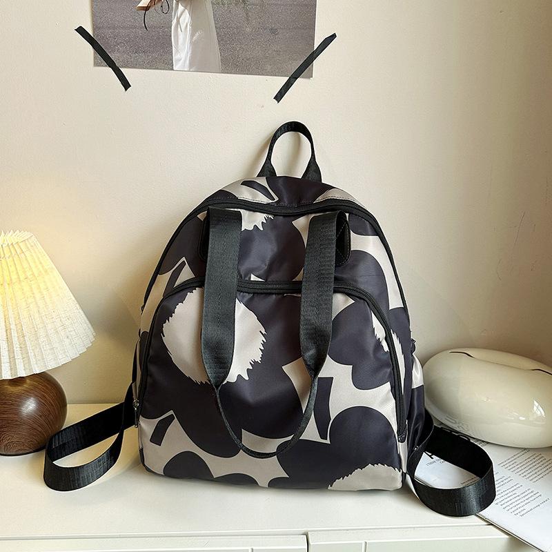 Schoolbag1011 new, fashionable multi-functional backpack, messenger women's bag, large-capacity casual schoolbag, versatile commuter backpack