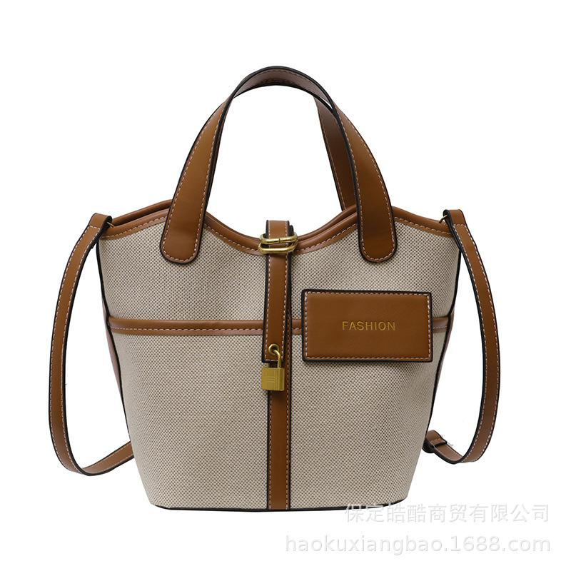 Canvas niche contrasting color handbag women's 2025 summer new Korean fashion shoulder messenger bag versatile bucket bag