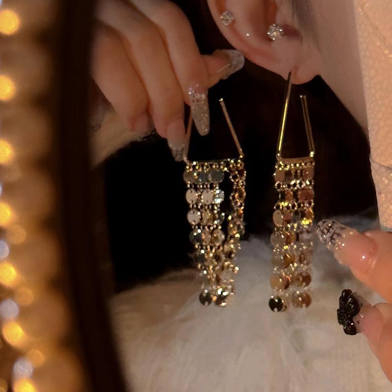 Silver Needle Sequin Tassel Earrings: Chic Cold Style, High-End Design, Fashionable Dangle for a Sophisticated Look.