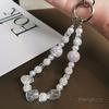 Pearl crystal mobile phone lanyard, short sparkling diamond bead bracelet, women's wrist anti lost hanging accessory