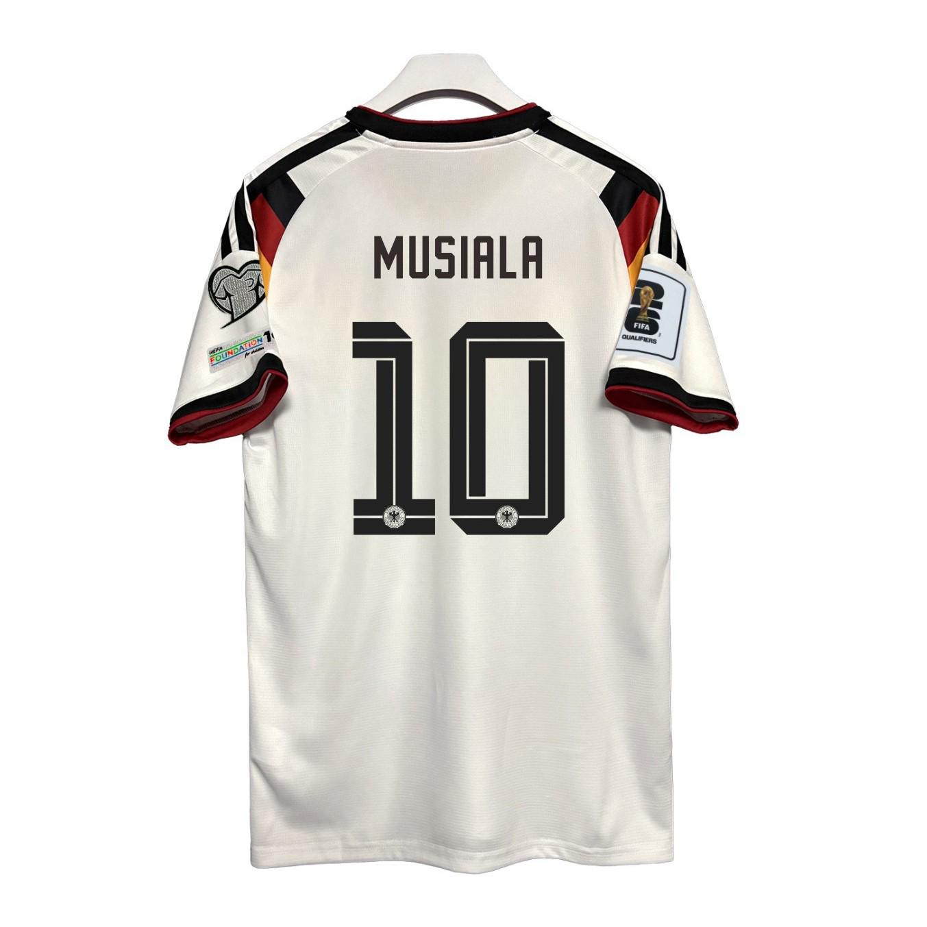 

Домашня футболка Чемпіонату світу 2026 Німеччина - Версії для вболівальників та гравців: Вірц, Мусіала, Зане S